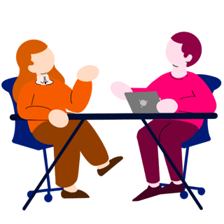 Two abstract figures in colorful outfits sit at a table. One gestures while the other uses a laptop, suggesting a casual conversation.