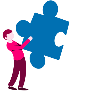 A person in a pink shirt and pants is holding a large blue puzzle piece.