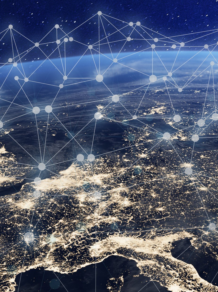 Aerial view of Europe at night, showcasing city lights interconnected by a digital network overlay, symbolizing global connectivity.