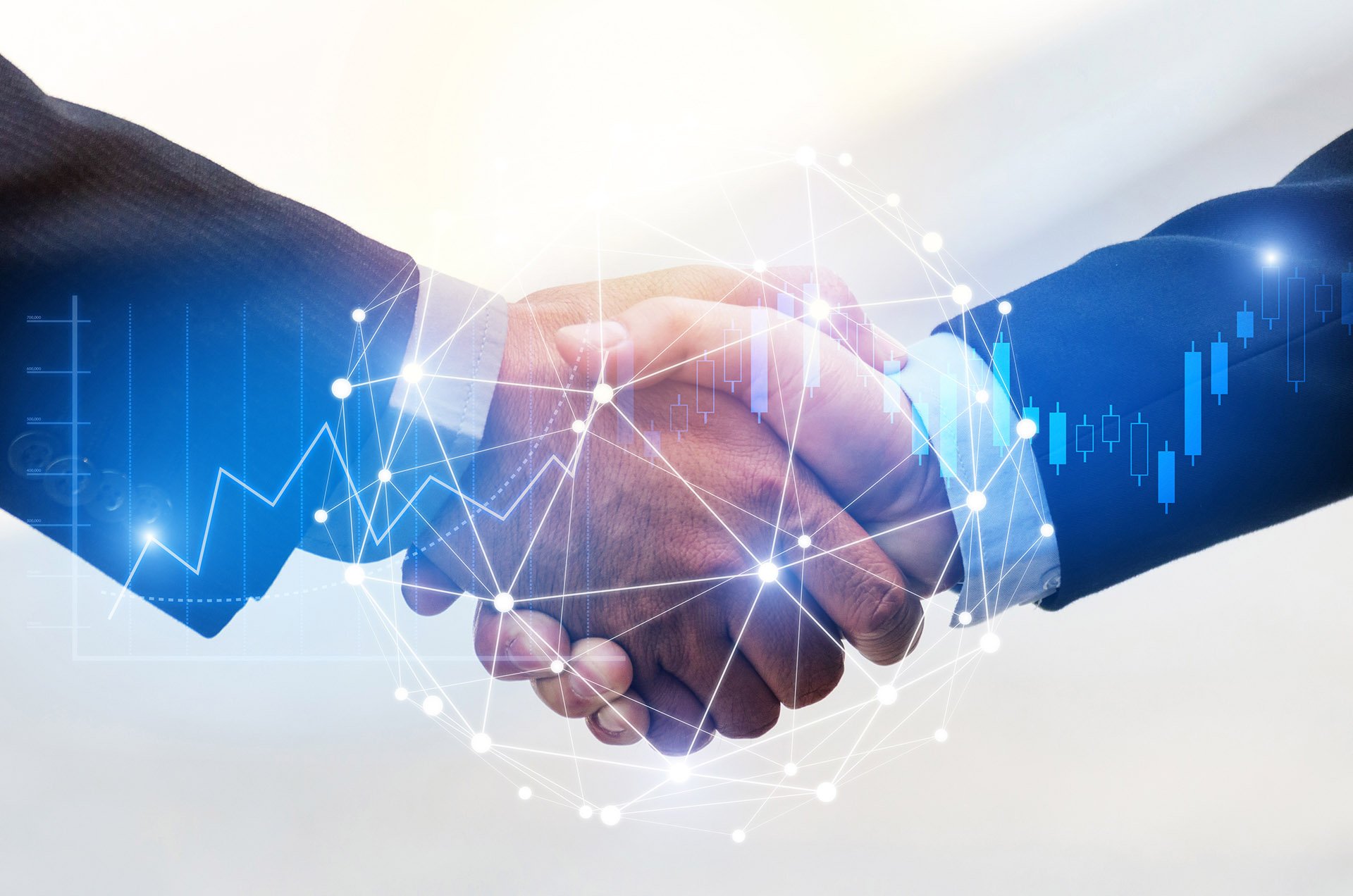 Two businessmen shake hands, overlayed with digital financial graphics symbolizing partnership and business success.