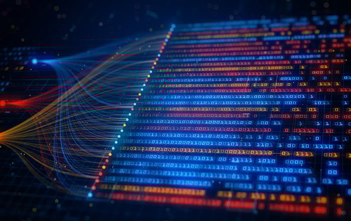Abstract visualization of binary code in blue and red, intertwined with colorful data streams on a dark background, representing digital information flow.